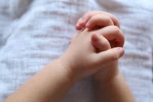 Child's hands in prayer