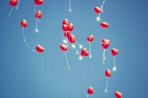 Releasing Red Heart Balloons
