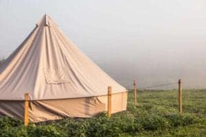 Tent with tent pegs to hold it down