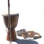 A djembe hand drum with a flutes and three tambourines