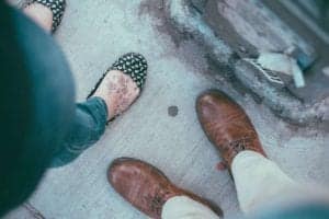 two pair of feet, a man's and a woman's, subject for contemplation