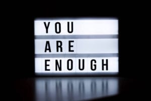 A sign that says "you are enough"