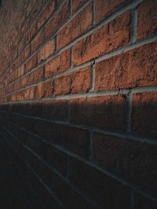 A side angle view of a brick wall