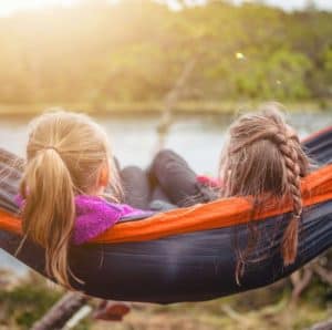 Two blood sisters in a hammock