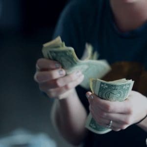 woman counting out money