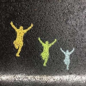chalk figures on a sidewalk