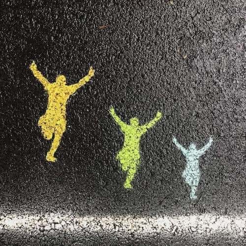 chalk figures on a sidewalk