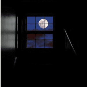 full moon at night through a window