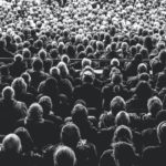 large crowd of people in black and white