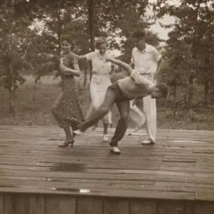 1940s couple dancing on wooden deck