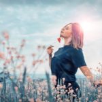 woman walking in flowers