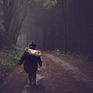 girl walking in valley of shadows