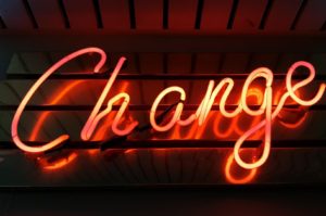 neon sign saying change