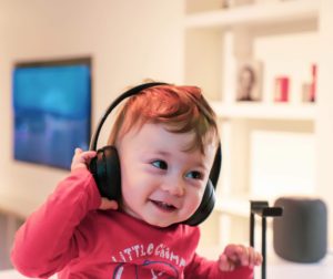 child listening with headphones