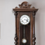 antique clock with pendulem that makes ticking noise