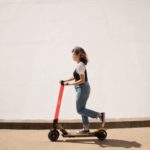 woman moving on a scooter