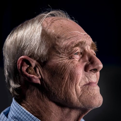 older man listening to bring comfort, memory