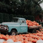 old truck with heavy load of pumpkins