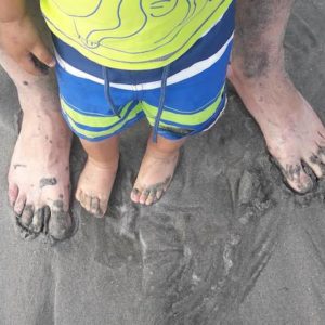 never too grown up to play in the sand barefoot