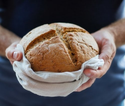 round loaf of fresh baked bread made from dough