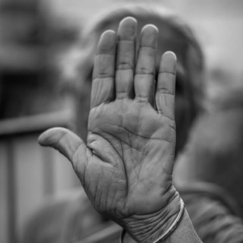 old lady who can claim agency lifting her hand to say stop