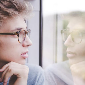 woman looking at herself in a mirror