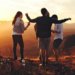 three woman dancing as they experience the magic of we