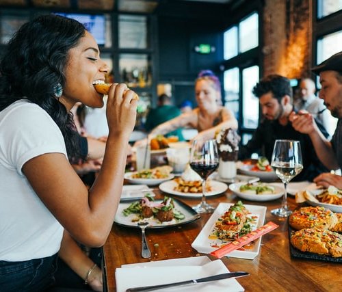 people in a restaurant eating. dopamine