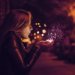 woman breathing upon magical lights in her hands, december declutter