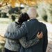 Couple standing at cemetery saying; goodbye; growing whole not old