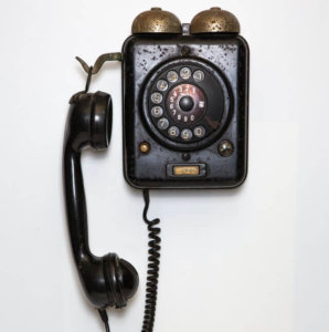 a wall phone as an example of old technology and spirituality