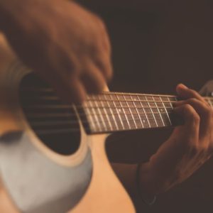 hand strumming guitar