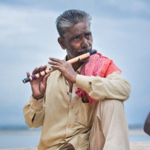 man playing flute