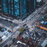 a view from a skyscraper of tiny things below