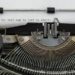 a typewriter showing the words "the best way is just to start' as guidance on how to write ardis mayo