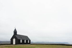 a closed church in an open filed, an example of a closing church, open hearts