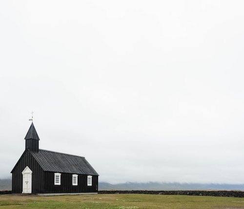 a closed church in an open filed, an example of a closing church, open hearts