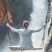 woman on a high swing over a steep gorge experiences the feeling of vulnerability