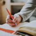 woman journaling to-do list and goals